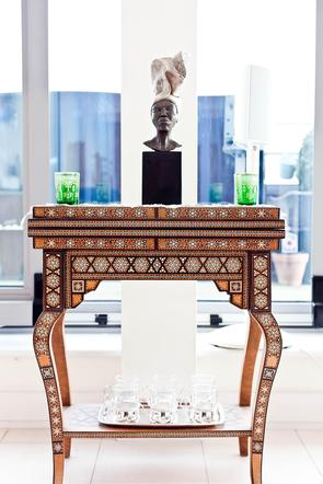 wooden table and statue in London short term rental