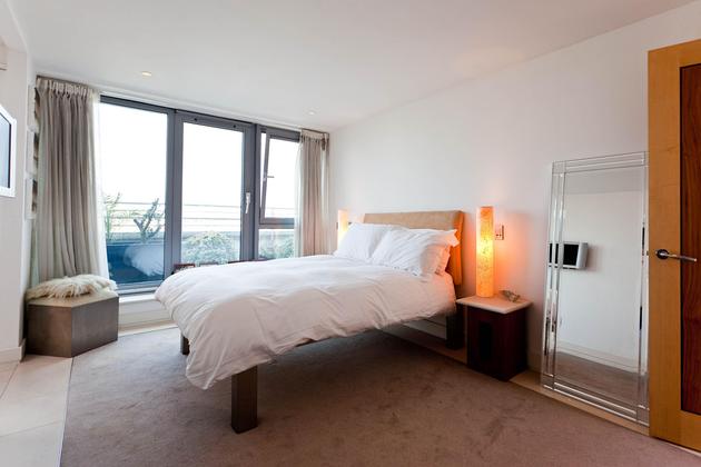 large double bedroom with city views of central London