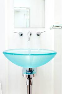 blue glass sink in Central London holiday flat