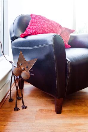 leather chair and metal cat in family accommodation in central London
