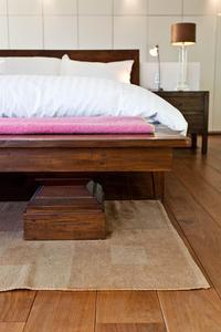 wooden floor and bed in London holiday flat