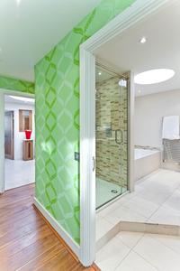 green glass walls in London holiday flat