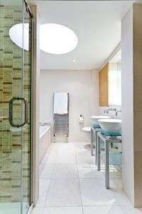 large modern bathroom in London serviced apartment