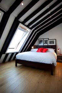 sun pouring through picture windows in apartment vacation rental in london