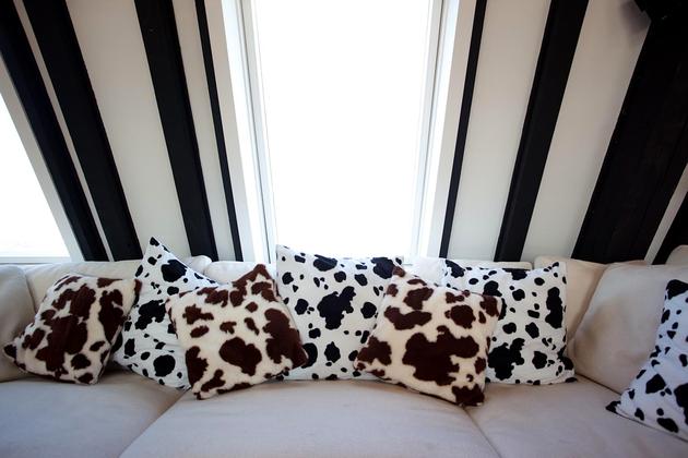 cow cushions on large sofa