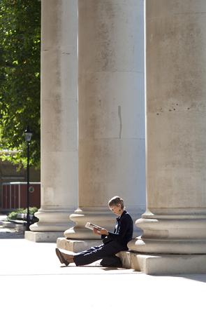 man stilling on pillar near london serviced apartments