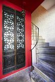 red door and stair case in short term rental in London